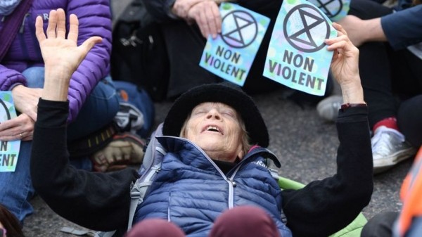 
                              Extinction Rebellion protester climbs on plane at London City Airport
                      